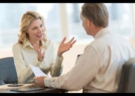 Woman interviewing for job with male manager